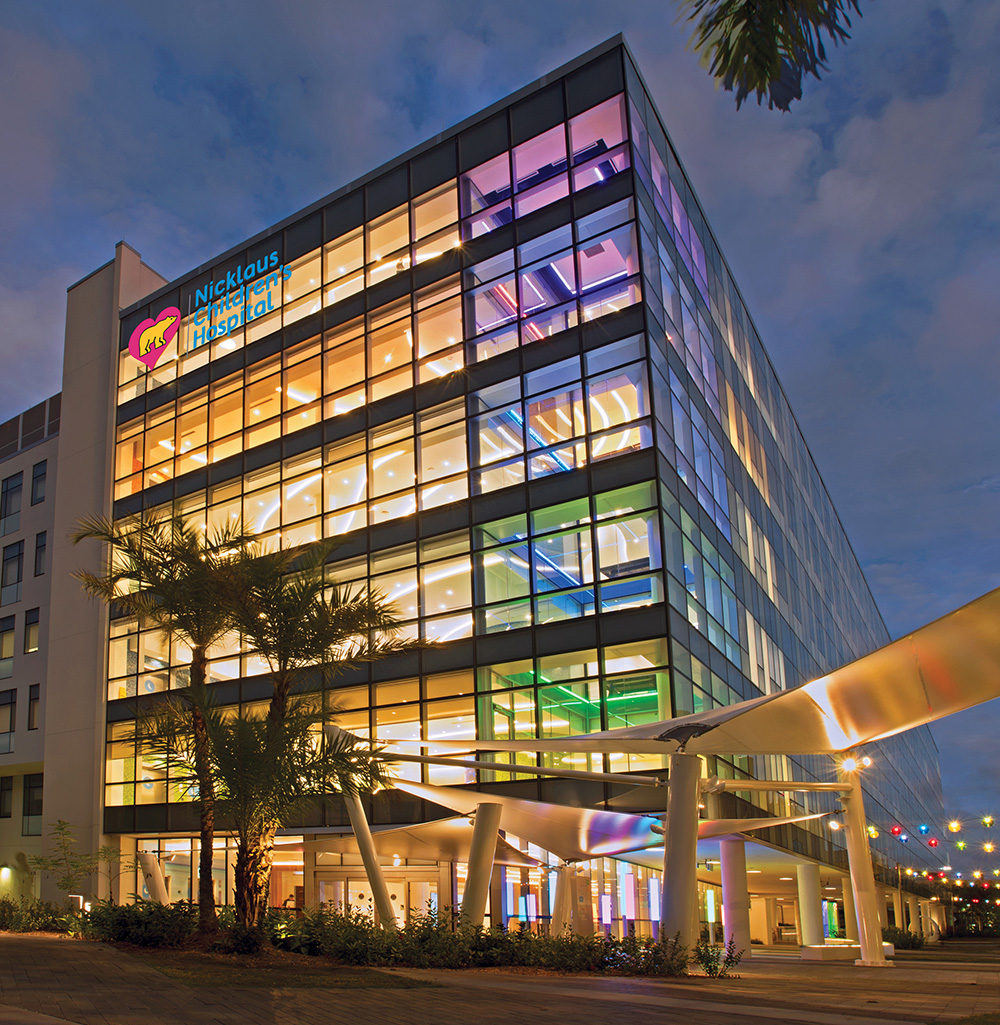 advanced pediatric care pavilion building at night time.