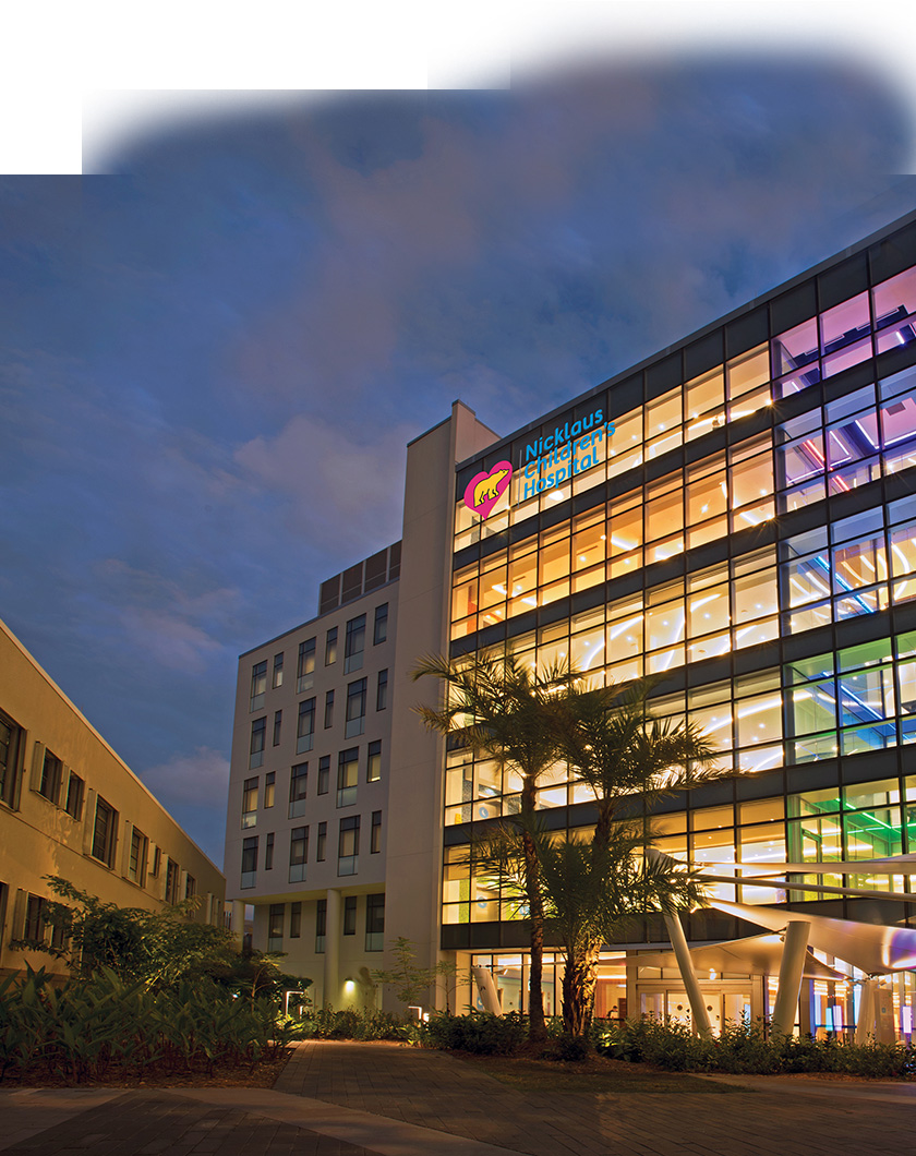 advanced pediatric care pavilion building at night time.